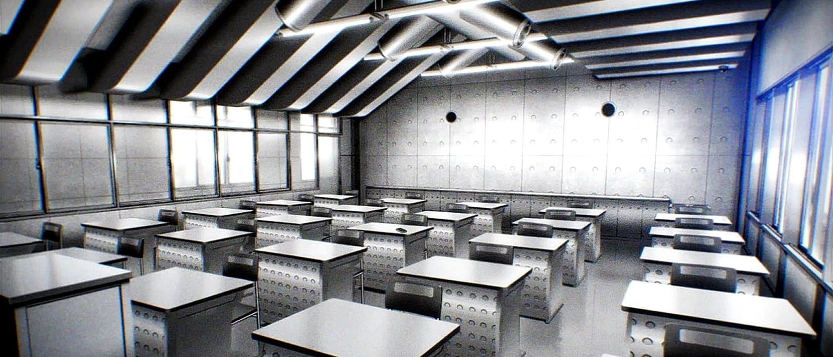 An empty classroom, desks in rows under strip lighting